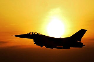 Top Gun fighter jet at sunset