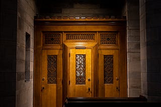 A confessional box within a church building.