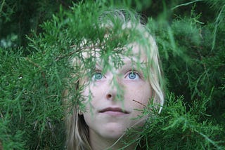 A girl looking into a green future