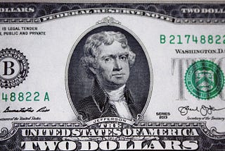picture of a two dollar bill, which is rare like the author