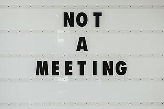 “Not a meeting” on white background.