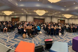 Ballroom with 400 attendees participating in the Panel for Mental Health at Grace Hopper Celebration.