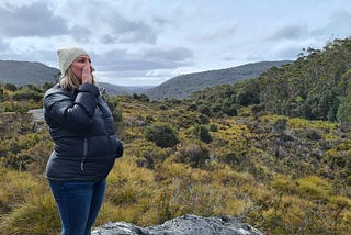 A woman in the wilderness calling the wild