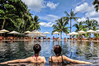 Relaxing in a pool at a resort: a job perk for international spies.