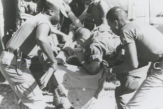 soldiers removing wounded during Vietnam war