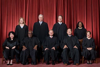 The Supreme Court as composed June 30, 2022 to present. Front row, left to right: Associate Justice Sonia Sotomayor, Associate Justice Clarence Thomas, Chief Justice John G. Roberts, Jr., Associate Justice Samuel A. Alito, Jr., and Associate Justice Elena Kagan. Back row, left to right: Associate Justice Amy Coney Barrett, Associate Justice Neil M. Gorsuch, Associate Justice Brett M. Kavanaugh, and Associate Justice Ketanji Brown Jackson. Credit: Fred Schilling, Collection of the Supreme Court o