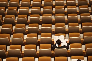 Student studying in a lecture hall — Photo by <a href=”https://unsplash.com/@flipboo?utm_source=unsplash&utm_medium=referral&utm_content=creditCopyText">Philippe Bout</a> on <a href=”/s/photos/study?utm_source=unsplash&utm_medium=referral&utm_content=creditCopyText”>Unsplash</a>