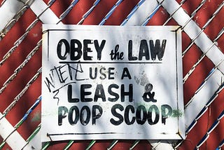 Sign — Obey the Law Use A Leash & Poop Scoop