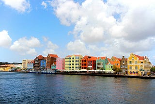 Vibrant pastel-colored buildings lined the harbor in Willemstad, Curaçao.