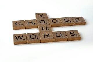 Scrabble letters that say You Choose Your Words