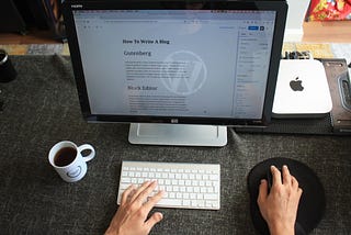 A computer with wordpress editor on the screen