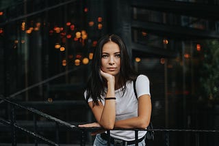 Young lady in white T-shirt looking at camera