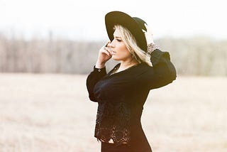 Beautiful woman standing in a field
