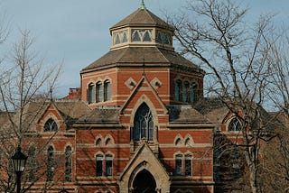 A large red brick building with a clock tower. Robinson Hall. Brown University