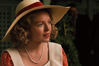 Diane Keaton as Kay Corleone in The Godfather 1972. She is wearing a straw sunhat and red and white polka-dot dress as she converses with Michael at his sister Connie’s wedding.