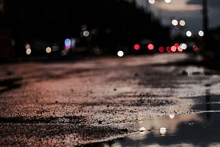 Puddles reflecting streetlights
