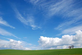 image of blue sky with a few clouds