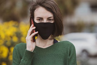 a woman calling someone on the phone with anger