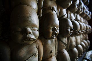 A row of baby sculptures…