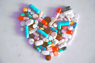Photo of a bunch of pills shaped into a heart