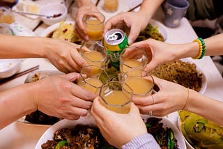 People toast a meal together.