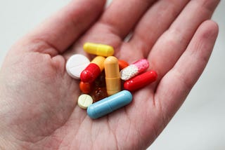 Hand holding pills