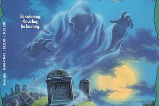 A spooky ghost hovers over a graveyard with the words “No swimming, no surfing, no haunting” above it.