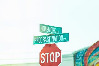 Stop sign at an intersection, featuring additional street signs that say, “Homework Avenue” and “Procrastination Park.”