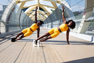 Two women exercising.