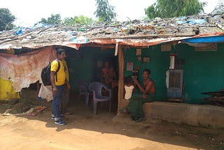 A Sun King Executive delivering clean energy products at teh customer’s doorstep