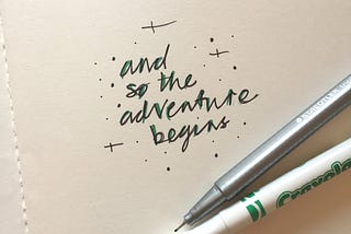 pen and paper with words ‘and so the adventure begins’