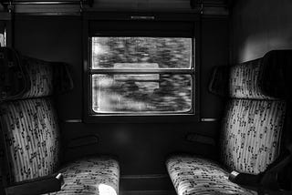 A train cabin, black and white image