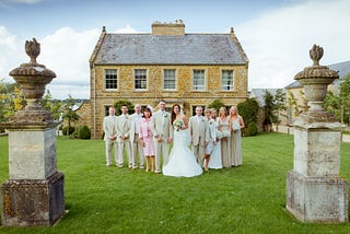 people posing outside wedding venue