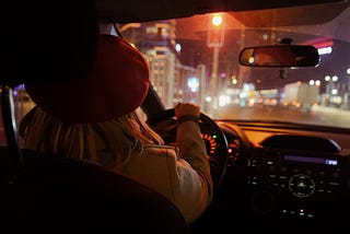 mother driving car at night