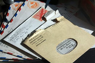An array of envelopes containing handwritten letters