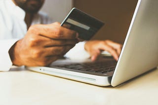 A person buying things online by using their credit card