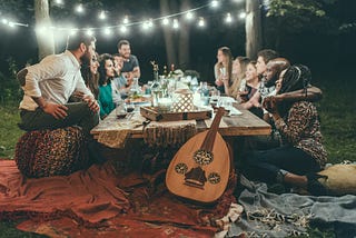 Group of friends having a dinner party outside