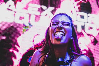 Girl at a party sticking out her tongue