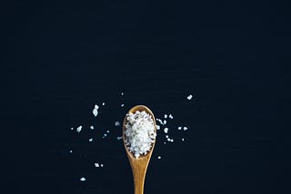 Coarse salt on a wooden spoon