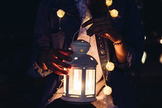 Person holding a lantern