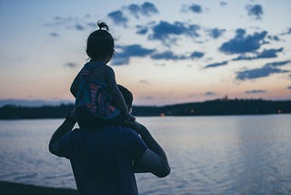 A young girl sits on her father’s shoulders. Or some man’s. Hope it’s her father. Dad 2.0 by Jim Latham is a sweet story, unlike this snarky commentary.