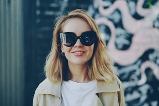 Older woman smiling wearing a sunglasses