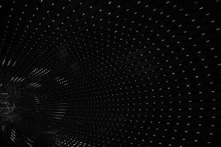 Banner image: white particles on black suggesting a tunnel,
slanted.