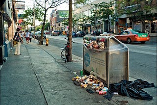 overflowing trash container in streets of Toronto