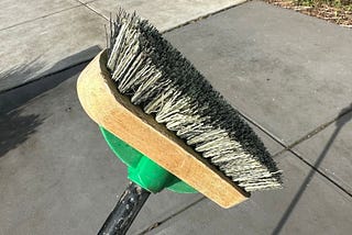 What is a deck brush and what is it used for?