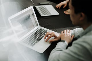 A person working on a laptop.