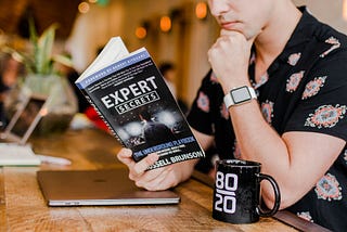 men reading a book about cybersecurity