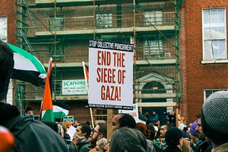 Protesters with signs saying “End the Siege of Gaza”
