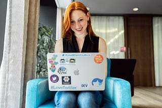 Developer woman codes on her laptop.