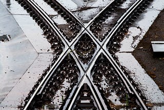 A railway track scissors-crossover in which a pair of switches connects two parallel rail tracks.